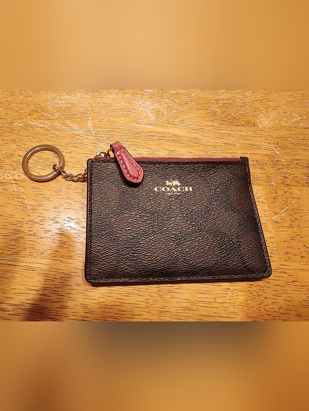 Coach Signature Coated Canvas Mini Skinny ID Case featuring a brown and black